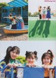 A group of young women standing next to each other on a playground.